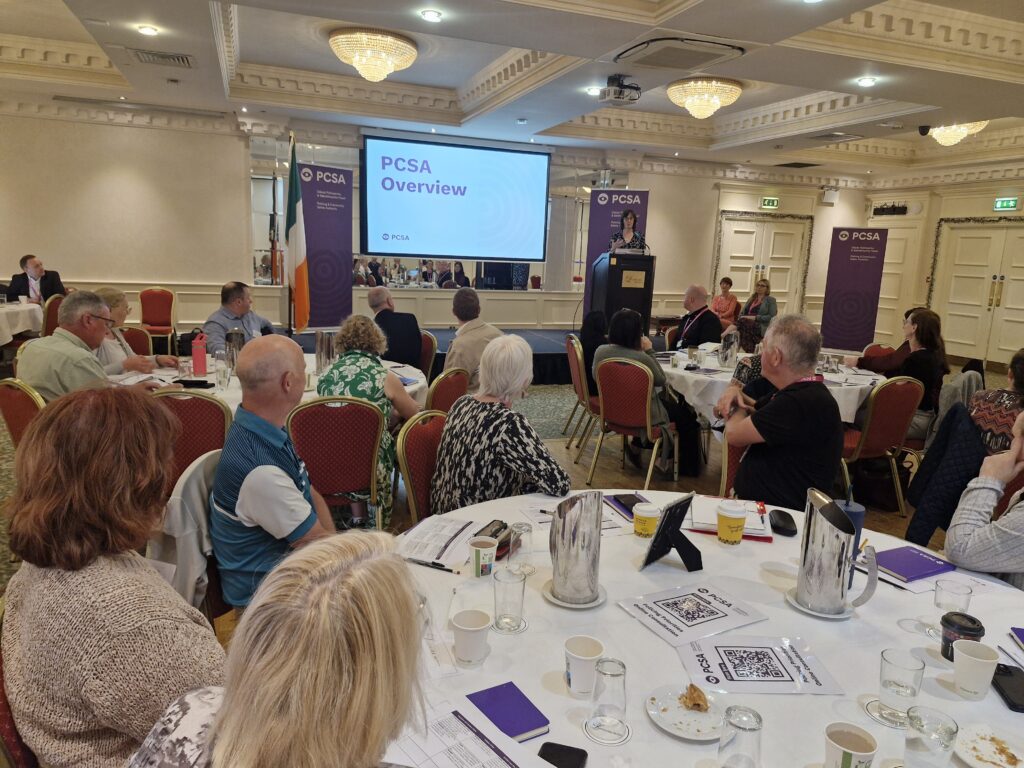 PCSA Helen Hall addresses a hotel rom full of people